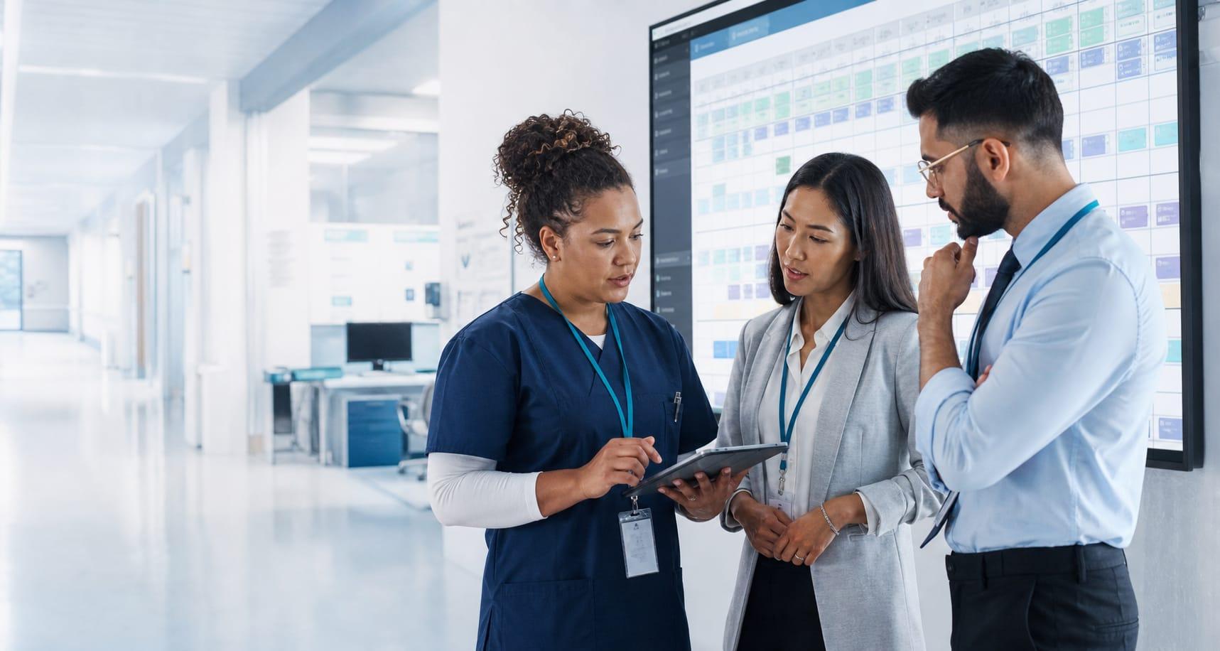 Global hospital workforce team coordinating clinical staff schedules